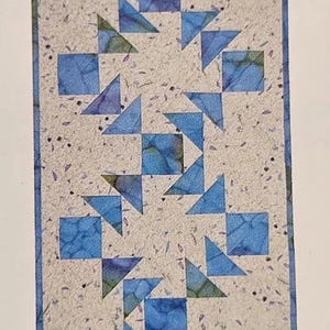 Crazy Eights Table Runner Pattern:By Carolyn Griffin For  Far-Flung Quilts Table Runner Size  (17" x 50")