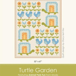 May include: A colorful quilt titled "Turtle Garden" featuring a repeating pattern of turtles, birds, and flowers. The quilt measures 53" x 67" and is designed by Stacy Iest Hsu. The design includes blue, green, orange, and cream colors.
