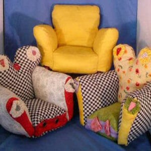 May include: Four small, colorful armchairs with unique fabric patterns. The chairs are made of fabric and have a soft, plush look. The chairs are perfect for a child's playroom or a cozy reading nook.
