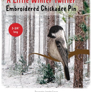 May include: Embroidered chickadee pin with a wintery forest background. The pin is 3-3/4 inches long. The text "A Little Winter Twitter Embroidered Chickadee Pin" is at the top of the image. The text "Designed by Jennifer Carson ©2018 The Dragon Charmer The Dragon Charmer" is at the bottom of the image.