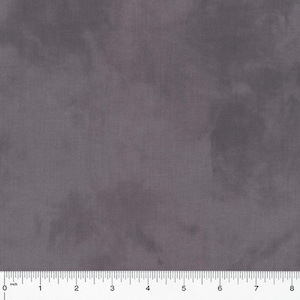 May include: A close-up of a piece of gray fabric with a subtle, textured appearance. The fabric has a soft, muted color and a slightly mottled effect. A ruler is placed along the bottom edge, showing measurements in inches.