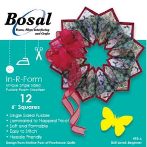 May include: A craft supply package featuring a wreath made of fabric with a red border and a large red bow. The package includes 12 squares, each 6 inches. The text on the package reads "Bosal In-R-Form" and "Beginner". A yellow butterfly is also visible.