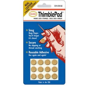 May include: A package of 12 ThimblePad reusable leather fingertip protectors. The package is blue and red with the text "ThimblePad" in white. The package shows a hand using a ThimblePad. The text "Real Leather Strong Flexible" is on the top of the package. The text "Works like a thimble... Feels like a dream" is below the product name. The text "Snug, Secure, Reusable Adhesive" is on the package. The text "Made in the USA" is at the bottom of the package.
