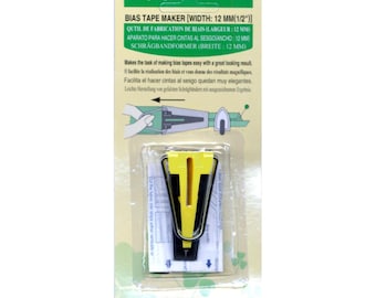 May include: A yellow and black bias tape maker for creating 1/2 inch bias tape. The package includes instructions for use in English, French, Spanish, German, and Dutch. The package also includes the text "Art No. 464/12" and "Clover MFG. CO., LTD. JAPAN".