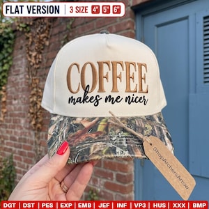 May include: A cream-coloured baseball cap with a camouflage-patterned brim. The front features the embroidered text COFFEE in brown and makes me nicer in black. A brown paper tag labelled ShopArchersArrow is attached to the brim with twine.