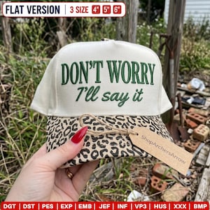 May include: A cream-coloured baseball cap with a leopard print brim and the dark green embroidered text DON'T WORRY I'll say it. The cap is available in 4 inch, 5 inch, and 6 inch sizes and includes a brown cardboard tag labelled ShopArchersArrow.