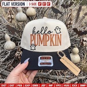 May include: A cream-colored baseball cap with a black brim featuring the embroidered text hello PUMPKIN in black and orange, accompanied by two small ghost icons. A sticker on the brim reads OTTO CLASSIC FIT MID PROFILE, and a tag reads ShopArchersArrow.