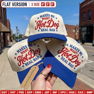 May include: Three cream-colored baseball caps with blue brims, each featuring red and blue embroidered text that reads "MAKES ME WANT A HOT DOG REAL BAD" with star accents. The caps are available in 4-inch, 5-inch, and 6-inch sizes.