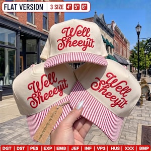 May include: Three cream-colored baseball caps with red embroidered text reading Well Sheeyit. Each cap features a red and white striped brim. A brown cardboard tag labeled ShopArchersArrow is attached to one cap. Text indicates 3 sizes: 4, 5, and 6 inches.