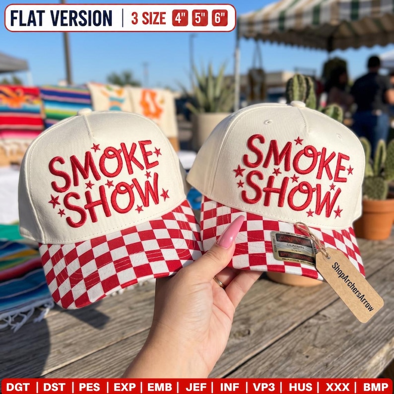 May include: Two off-white baseball caps with red and white checkered brims. The front panels feature red embroidered text reading SMOKE SHOW with small star accents. A brown cardboard tag is attached to one cap. Text at the top reads 3 SIZE 4" 5" 6".