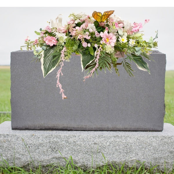 Cemetery graveside flower arrangement, headstone memorial arrangement, delicate pink and white butterfly headstone saddle.