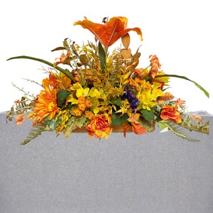Cemetery graveside saddle flower arrangement, fall headstone memorial arrangement, autumn thanksgiving cemetery arrangement.