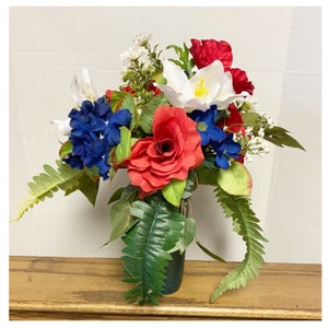 Graveside red, white, and blue flower vase, memorial grave site floral decoration,vase of patriotic floral arrangement for cemetery.