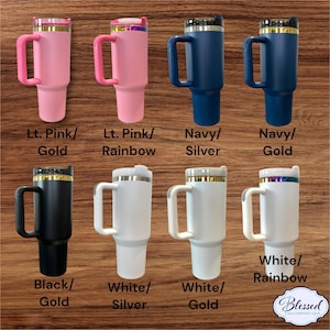 May include: Collection of insulated tumblers in various colors, including light pink, navy, black, and white. Each tumbler features a handle and a lid with gold, silver, or rainbow accents. The text on the image reads "Lt. Pink/Gold", "Navy/Silver", and more.