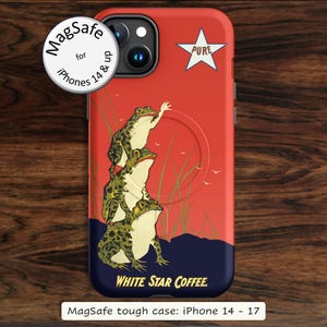 May include: A red and dark blue phone case for iPhone 14 and up featuring a stack of three green frogs, tall grass, and a white star with the text PURE. The bottom includes the text WHITE STAR COFFEE. A circular MagSafe label is visible.