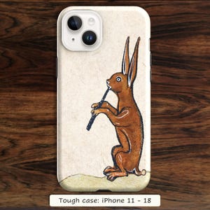 May include: A phone case featuring a brown rabbit standing on its hind legs and playing a black flute. The background is a light cream color. The text at the bottom reads: Tough case: iPhone 11 - 18. The case has a camera cutout.