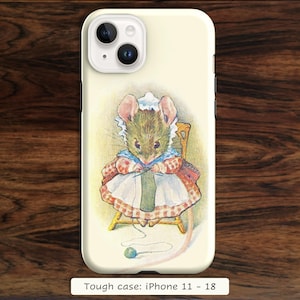 May include: A cream-colored phone case featuring an illustration of a mouse wearing a white bonnet and a red and white checkered dress, sitting on a chair and knitting with green yarn. The text reads Tough case: iPhone 11 - 18.