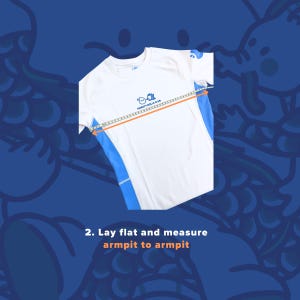 May include: White athletic shirt with blue side panels, being measured armpit to armpit with a measuring tape. The shirt has the text "SWEATY ROLLS CLUB" and a small logo. The image is on a blue background with a dragon design.