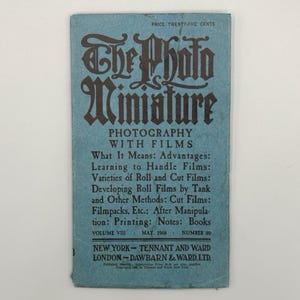 May include: A vintage blue booklet titled "The Photo Miniature" with black lettering. The cover includes text about photography with films, including advantages, handling films, and developing roll films. Published in May 1908.