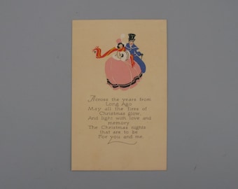 May include: Vintage Christmas card with an illustration of a couple in formal attire. The woman wears a pink dress and red scarf, while the man is in a blue coat and top hat. Text reads "Across the years from Long Ago..."
