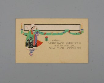 May include: Vintage Christmas greeting card with an illustration of a figure holding candles and gifts. The figure is wearing a green coat with black and white accents. The card includes the text: "To extend Christmas greetings and to wish you NEW YEAR HAPPINESS."