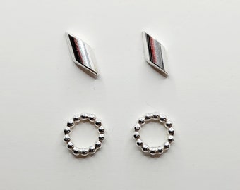 Two pairs of silver stud earrings (set 1)