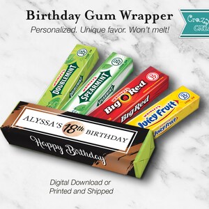 May include: A black and gold birthday party favor box with the text "ALYSSA'S 18th BIRTHDAY Happy Birthday" on the front. The box is decorated with a gold brushstroke design. The box is filled with four packs of chewing gum: Doublemint, Spearmint, Big Red, and Juicy Fruit.