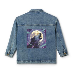May include: A blue denim jacket featuring a square graphic on the back. The graphic depicts a wolf howling at a large, bright yellow full moon set against a purple, starry night sky with light green aurora borealis streaks in the background.