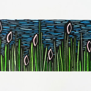 May include: A black and white woodblock print of a landscape with green grass, blue water, and pink flowers. The print is signed and numbered "1/30".