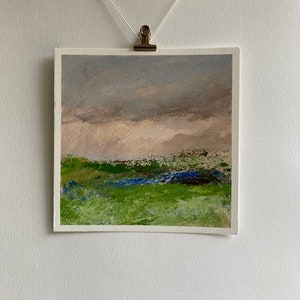 May include: Abstract landscape painting featuring a green field, blue sky, and brown hills in the background.
