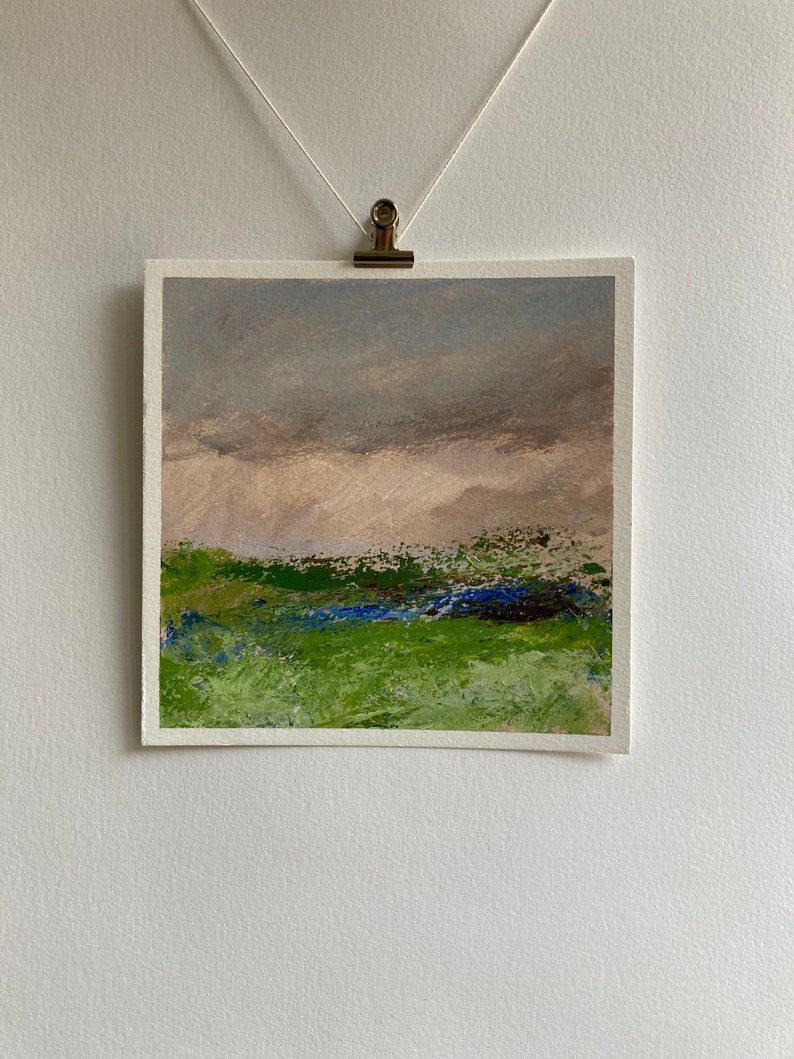 May include: Abstract landscape painting featuring a green field, blue sky, and brown hills in the background.