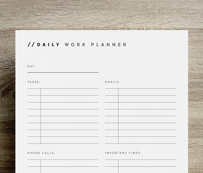 May include: A printable daily work planner with sections for tasks, emails, phone calls, and important times. The planner has a simple black and white design.