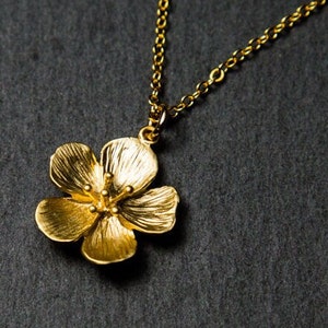 Gold flower necklace. Necklace in gift box.