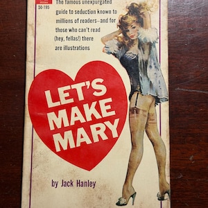 May include: Vintage paperback book cover with the title "LET'S MAKE MARY" in white letters on a red heart. The cover features an illustration of a woman in lingerie and text that reads "The famous unexpurgated guide to seduction".