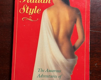 May include: A vintage paperback book titled "Love Italian Style" with a red cover. The cover features a woman draped in white fabric, viewed from the back. The text "The Amorous Adventures of an Englishman Abroad" is also visible.
