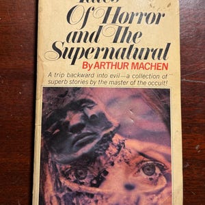 May include: Vintage paperback book titled "Tales Of Horror and The Supernatural" by Arthur Machen. The cover features a dark, eerie illustration of a face with a close-up of an eye. The book is a volume one from Pinnacle Books.