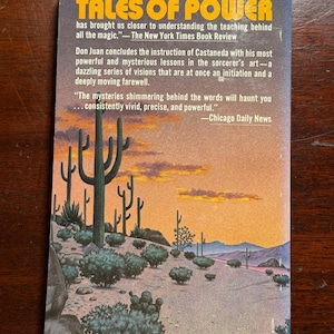 May include: A book cover with a desert landscape featuring a sunset and cacti. The title of the book is "Tales of Power" and the text on the cover includes quotes from The New York Times Book Review and Chicago Daily News.