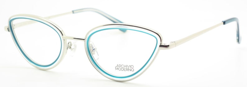 May include: Silver cat-eye glasses with a blue trim around the lenses. The brand name "Archivio Moderno" is printed on the frame.