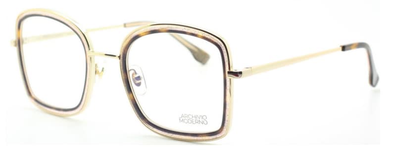 May include: Gold-rimmed eyeglasses with a tortoise shell frame and clear lenses. The frame has a subtle sparkle and the arms are gold metal. The brand name "Archivio Moderno" is printed on the frame.