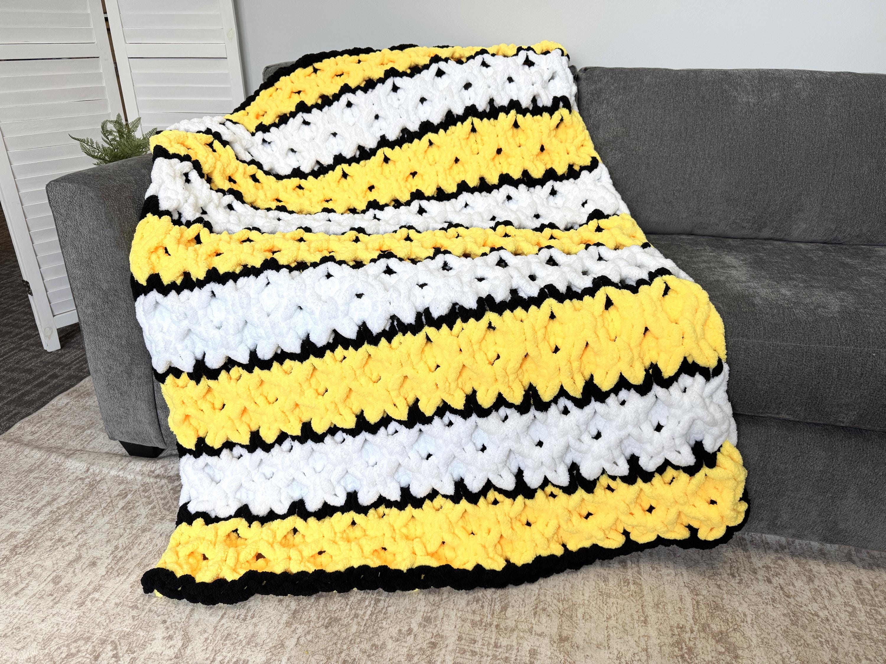 I draped a couch blanket over my shoulders, and my husband moved to the other side