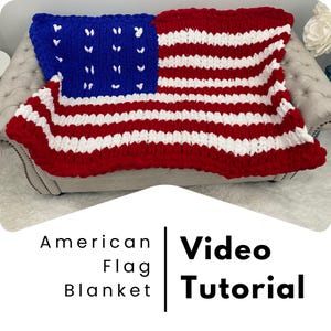 May include: A red, white and blue knitted American flag blanket. The blanket is made with chunky yarn and has a textured look. The text "American Flag Blanket" and "Video Tutorial" is displayed on the image.
