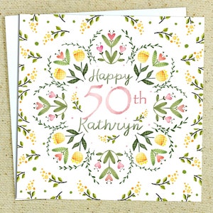Carte d'anniversaire personnalisée avec âge et bordure florale
