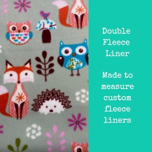 May include: A green fleece fabric with a repeating pattern of owls, foxes, hedgehogs, and flowers. The text "Double Fleece Liner Made to measure custom fleece liners" is on the right side of the image.