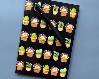 A5 Hedgehog in plant pot note book. 48-page A5 notebooks with full colour hedgehog cover.