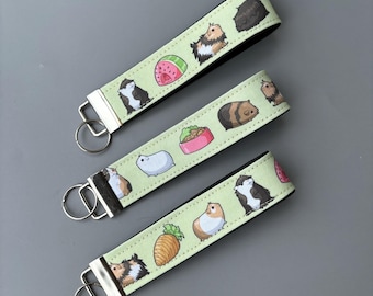Guinea pig wristlet keychain. Guinea pig keyring. Guinea pigs wrist strap keyring.