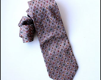 May include: A brown patterned silk tie with a paisley design. The tie has a dark brown, red, and white pattern.