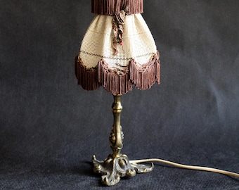 Antique metal brass lamp, bedside table, desk column, luxurious detail, Vintage style: Antique metal table lamp