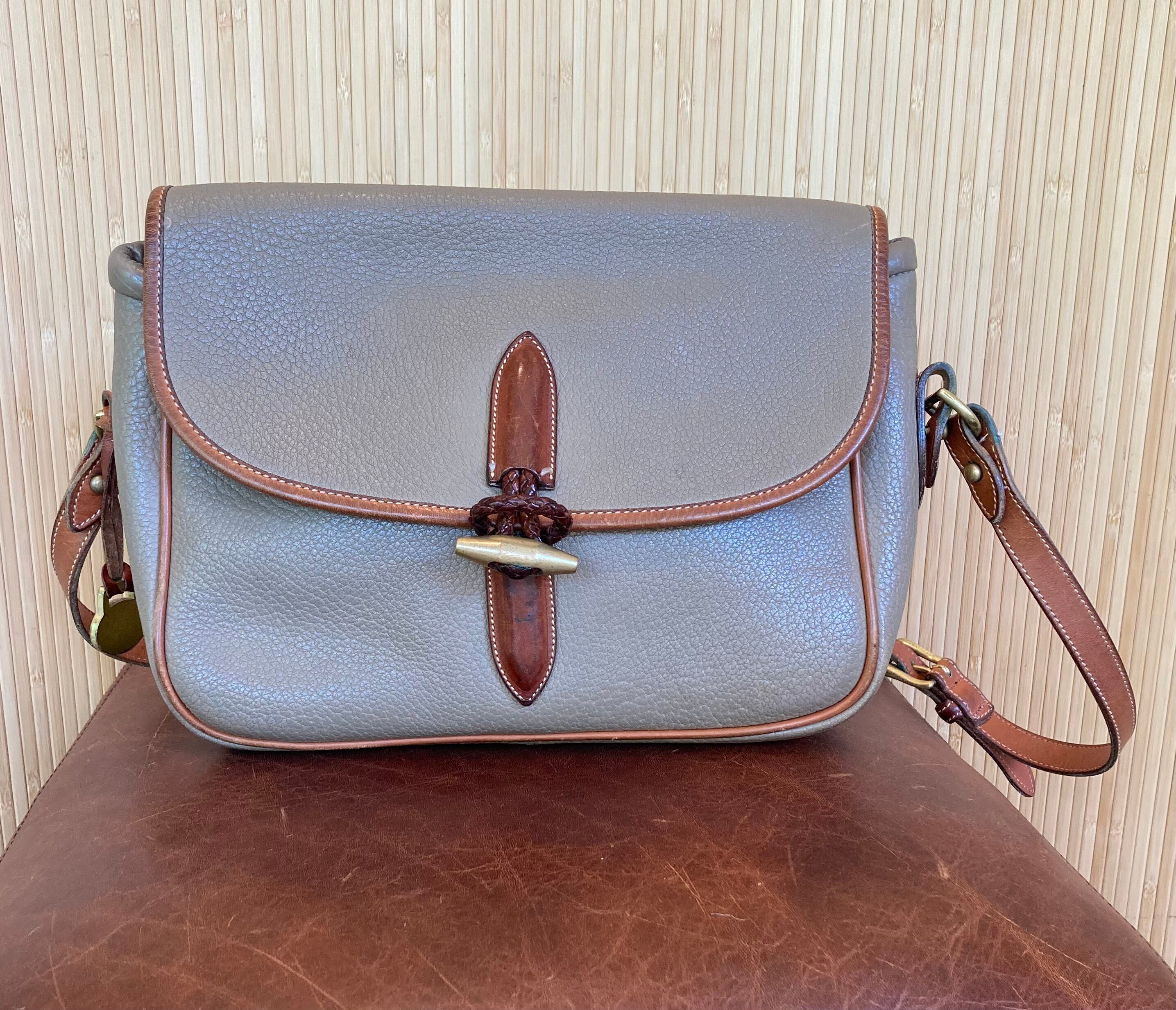 Dooney and bourke flap bedside tab satchel