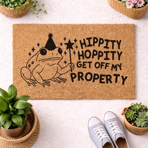 May include: A set of three ceramic mugs with a speckled, matte finish. The mugs are in shades of cream, light gray, and dark gray. Each mug has a simple, minimalist design and a rounded handle.