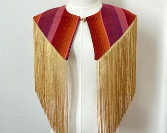 Striped reversible green and pink fringe capelet with gold tassels, boho western style serape cape